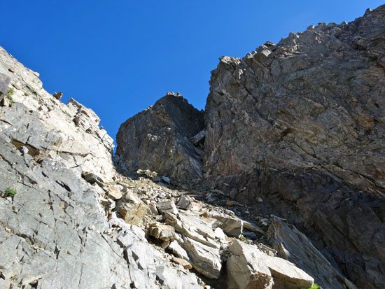 Chimney In Shadow at top of Couloir - 5.2