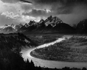 The Tetons And Snake River by Ansel Adams | Ansel Adams [Public domain], <a href="https://commons.wikimedia.org/wiki/File%3AAdams_The_Tetons_and_the_Snake_River.jpg" srcset=